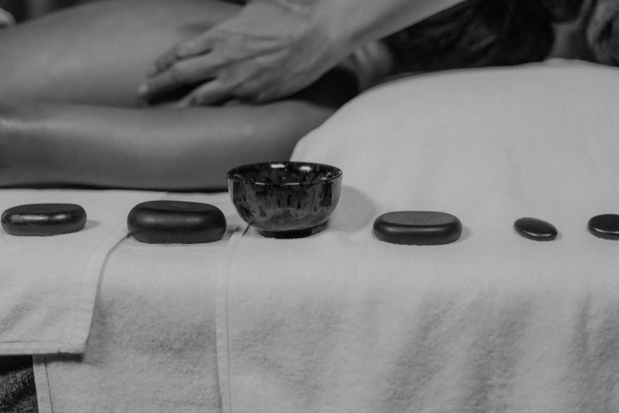 Hot stones on the back during a massage